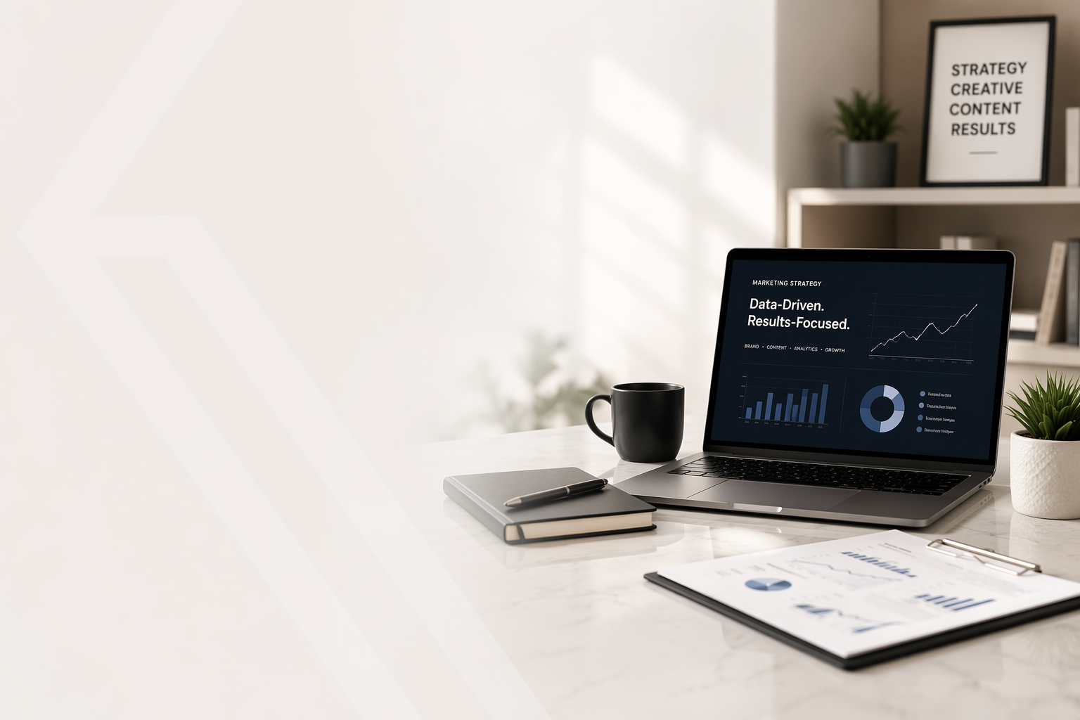 Laptop and documents on desk